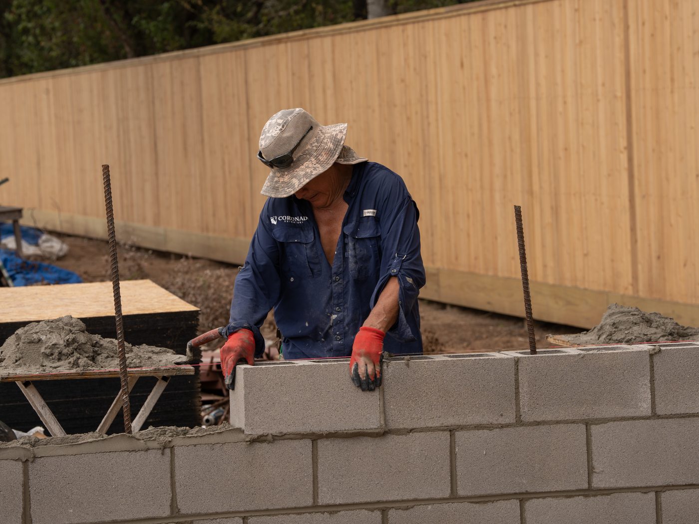 Coronado Exteriors mason laying concrete block