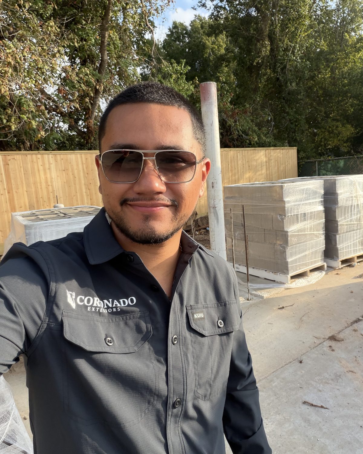 Alejandro Coronado, owner of Coronado Exteriors, on a CMU block wall jobsite in Houston