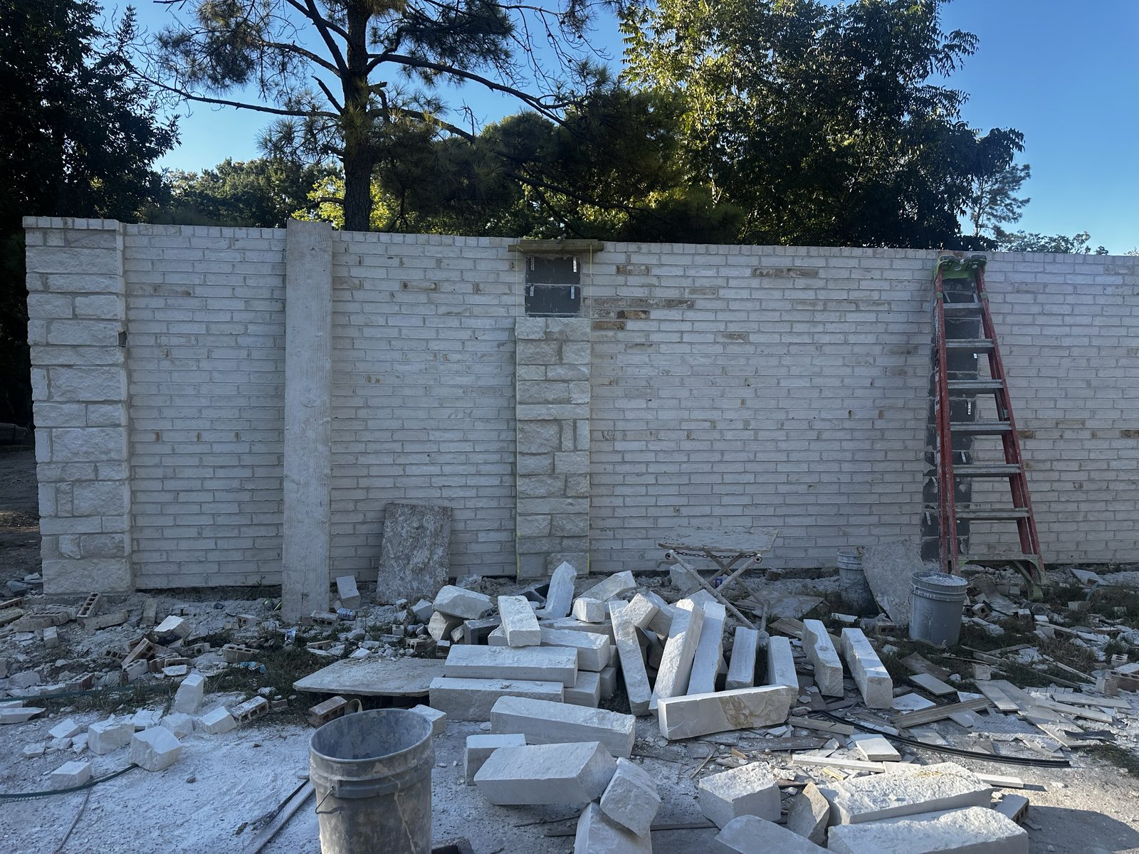 Coronado Exteriors building a stone wall